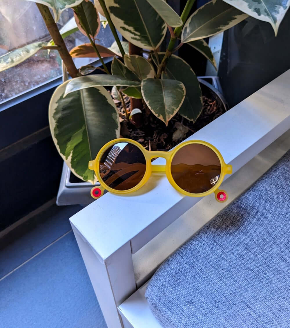 Yellow BB Kids Sunnies with Brown Lenses in a round style that never goes out of fashion for your little ones.